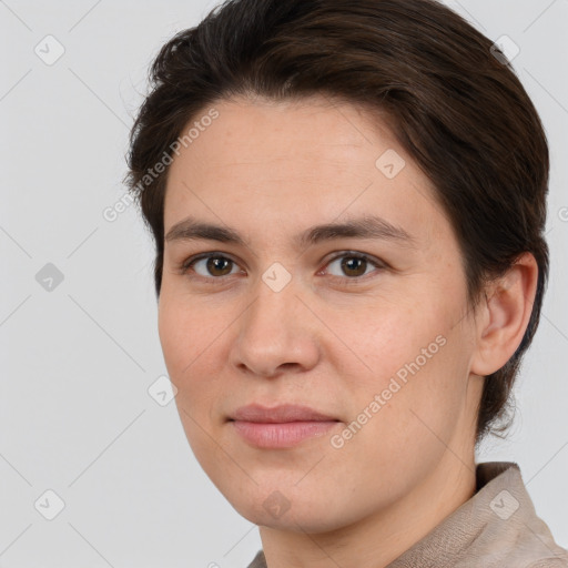 Joyful white young-adult female with short  brown hair and brown eyes