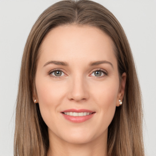 Joyful white young-adult female with long  brown hair and grey eyes