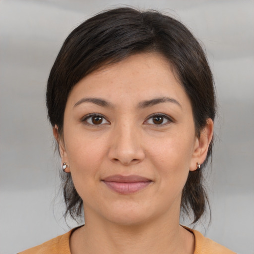 Joyful white young-adult female with medium  brown hair and brown eyes