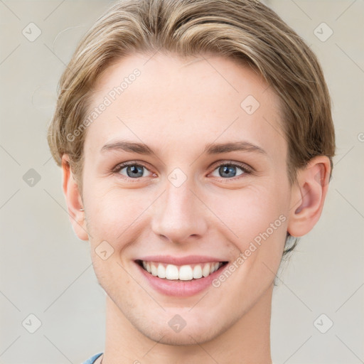 Joyful white young-adult female with short  brown hair and grey eyes