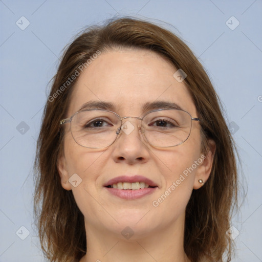 Joyful white adult female with medium  brown hair and grey eyes