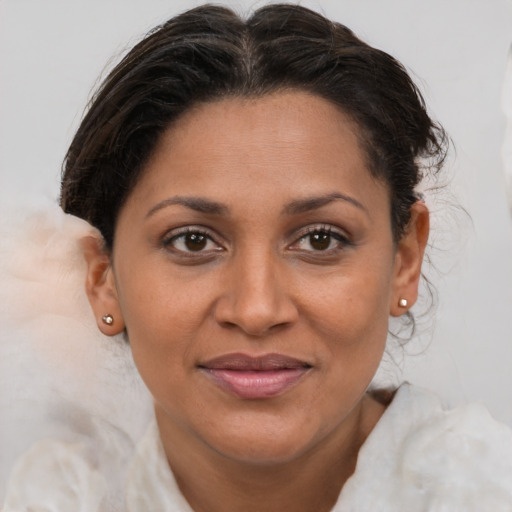 Joyful white adult female with medium  brown hair and brown eyes