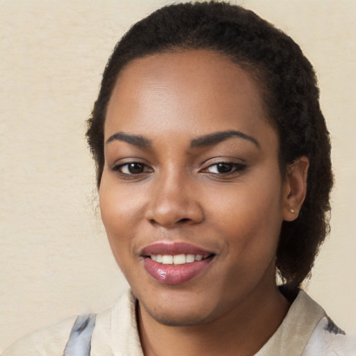 Joyful white young-adult female with long  black hair and brown eyes