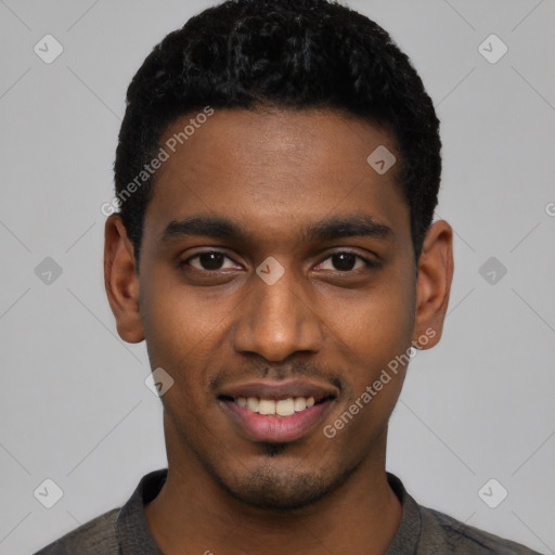 Joyful black young-adult male with short  black hair and brown eyes