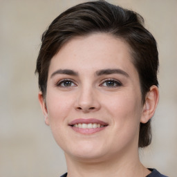 Joyful white young-adult female with medium  brown hair and brown eyes