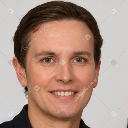 Joyful white adult male with short  brown hair and grey eyes