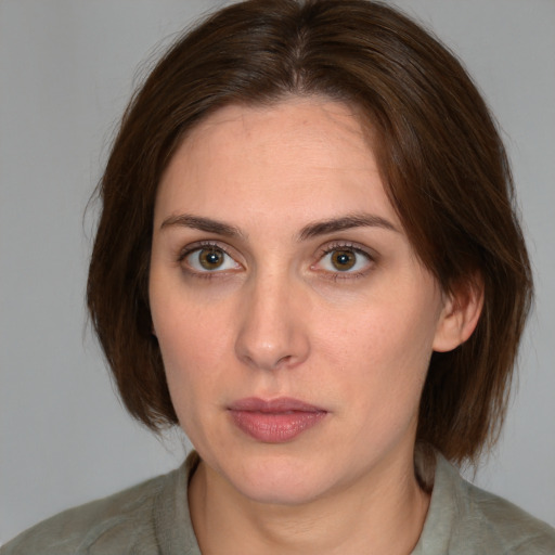 Neutral white young-adult female with medium  brown hair and green eyes