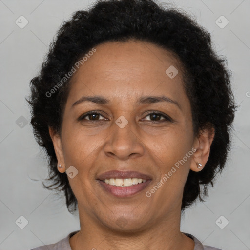 Joyful latino adult female with short  brown hair and brown eyes