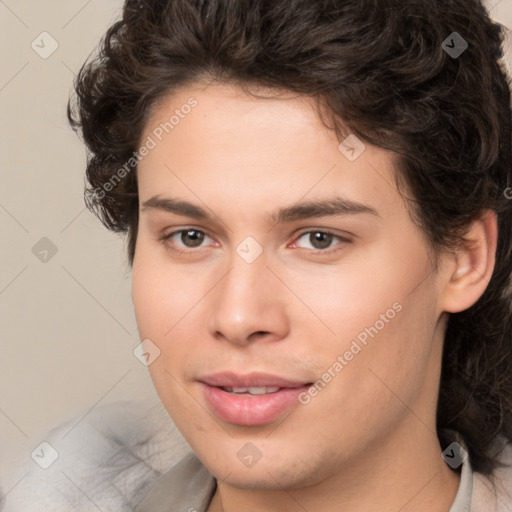 Joyful white young-adult male with medium  brown hair and brown eyes