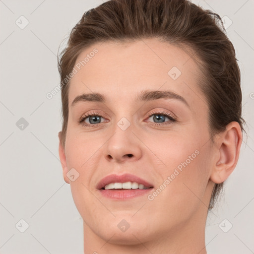 Joyful white young-adult female with medium  brown hair and grey eyes