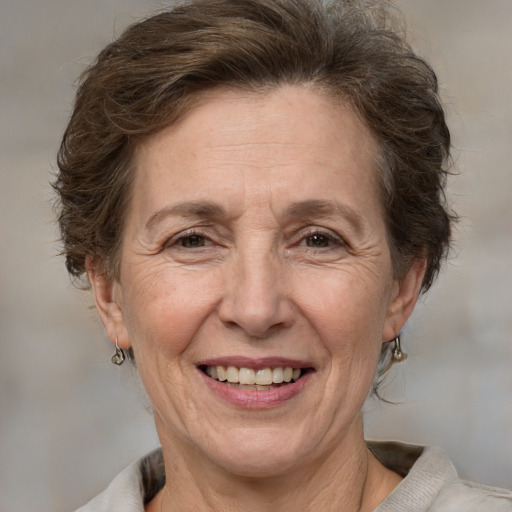 Joyful white middle-aged female with short  brown hair and brown eyes