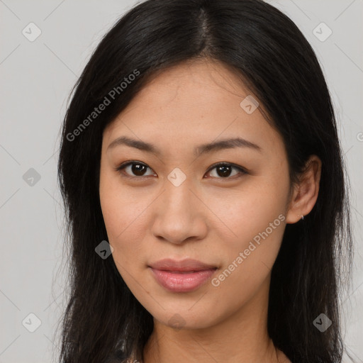 Joyful latino young-adult female with long  brown hair and brown eyes