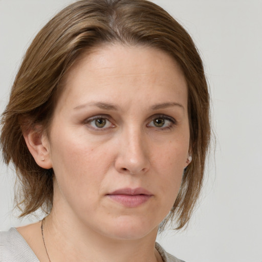 Neutral white adult female with medium  brown hair and grey eyes