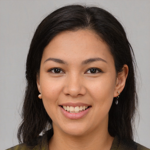 Joyful asian young-adult female with medium  brown hair and brown eyes