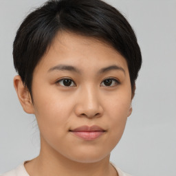 Joyful asian young-adult female with short  brown hair and brown eyes