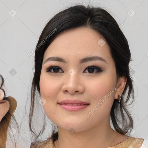 Joyful asian young-adult female with medium  black hair and brown eyes