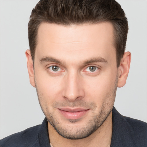 Joyful white young-adult male with short  brown hair and brown eyes