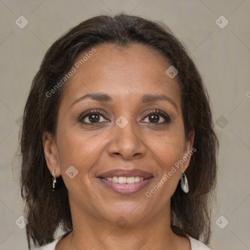 Joyful black adult female with medium  brown hair and brown eyes