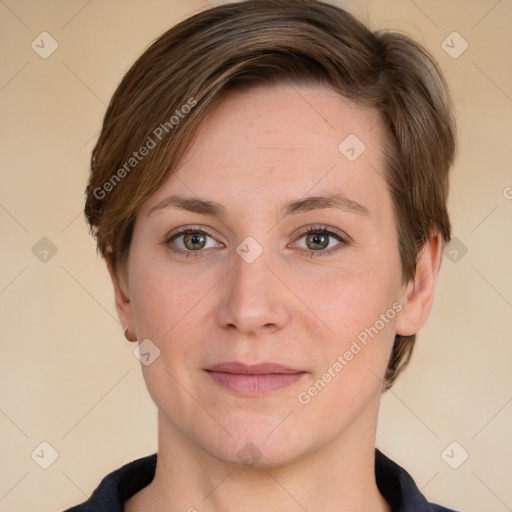 Joyful white adult female with short  brown hair and grey eyes