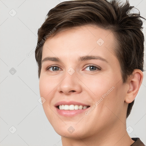 Joyful white young-adult female with short  brown hair and brown eyes