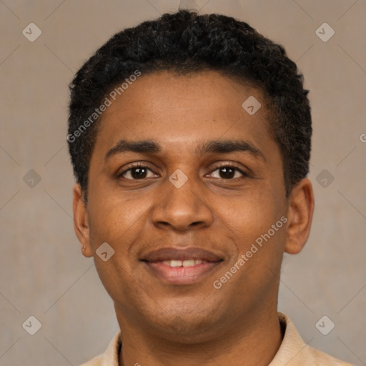 Joyful black young-adult male with short  black hair and brown eyes