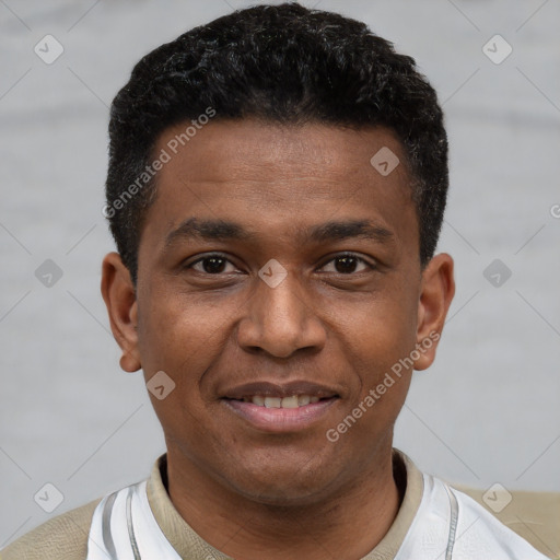 Joyful latino young-adult male with short  black hair and brown eyes