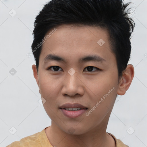 Joyful asian young-adult male with short  brown hair and brown eyes