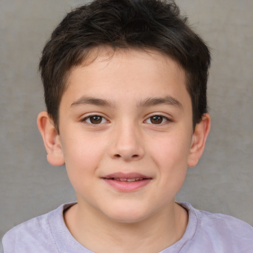 Joyful white child male with short  brown hair and brown eyes