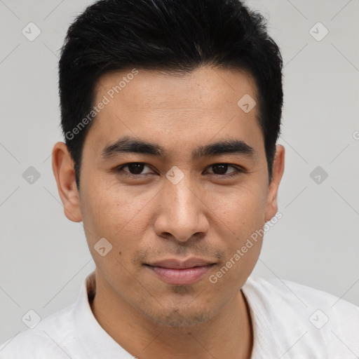 Joyful asian young-adult male with short  brown hair and brown eyes