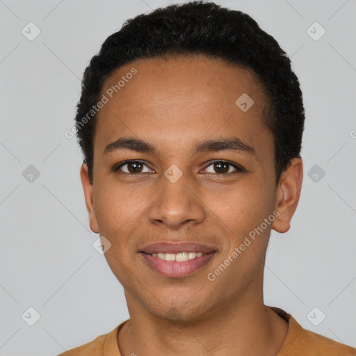 Joyful black young-adult male with short  black hair and brown eyes