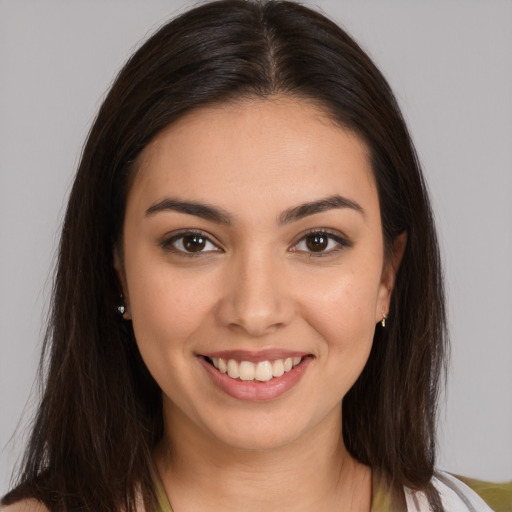 Joyful white young-adult female with long  brown hair and brown eyes