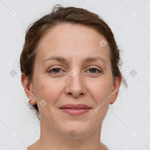 Joyful white adult female with medium  brown hair and grey eyes