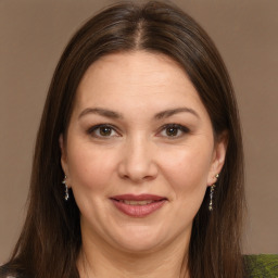 Joyful white young-adult female with medium  brown hair and brown eyes