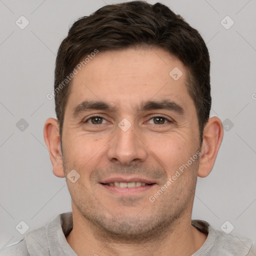 Joyful white young-adult male with short  brown hair and brown eyes