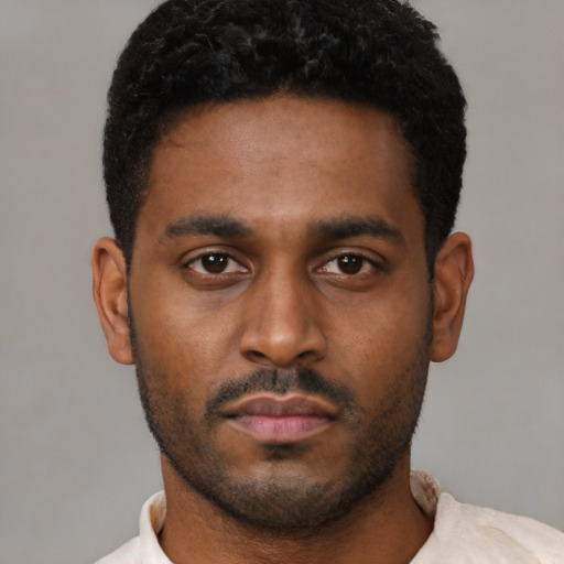 Neutral latino young-adult male with short  black hair and brown eyes