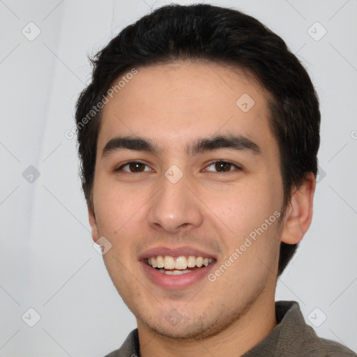 Joyful white young-adult male with short  black hair and brown eyes