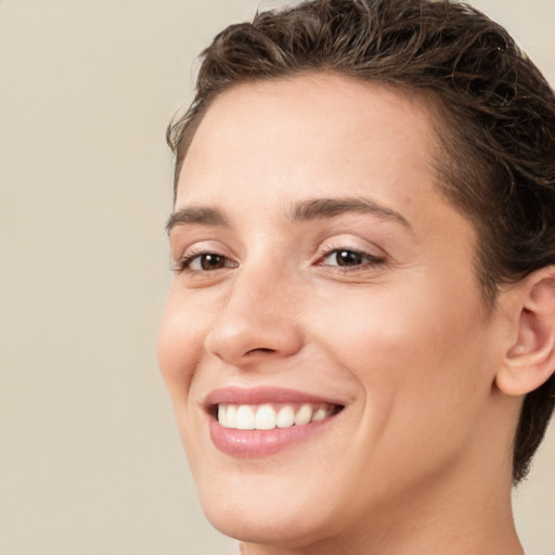 Joyful white young-adult female with medium  brown hair and brown eyes