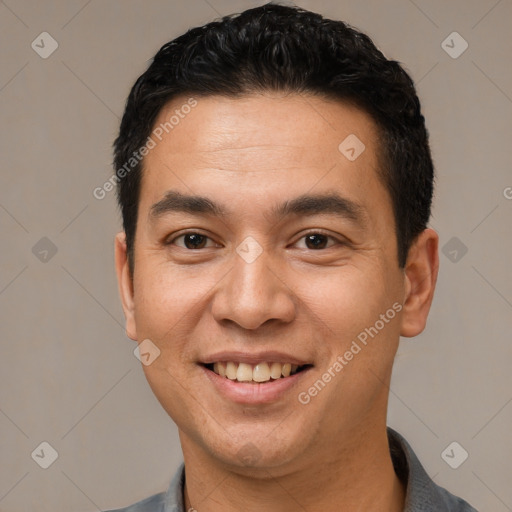 Joyful white young-adult male with short  black hair and brown eyes