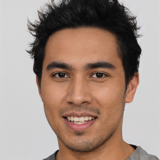 Joyful asian young-adult male with short  brown hair and brown eyes