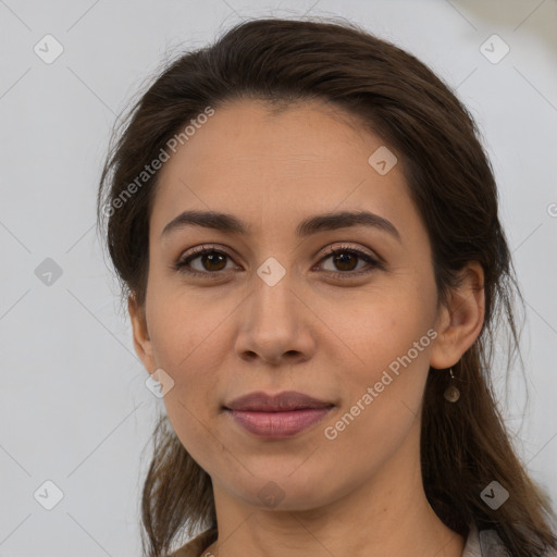 Joyful white young-adult female with long  brown hair and brown eyes