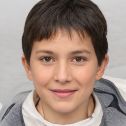 Joyful white child female with short  brown hair and brown eyes