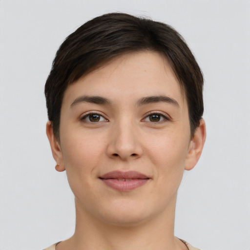 Joyful white young-adult female with short  brown hair and brown eyes