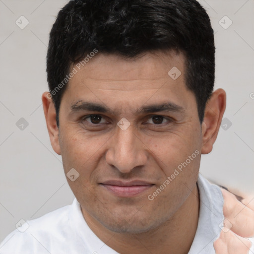 Joyful white adult male with short  brown hair and brown eyes