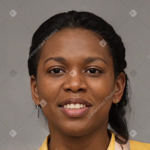 Joyful black young-adult female with short  black hair and brown eyes