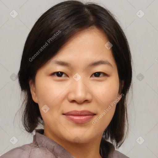 Joyful asian young-adult female with medium  brown hair and brown eyes