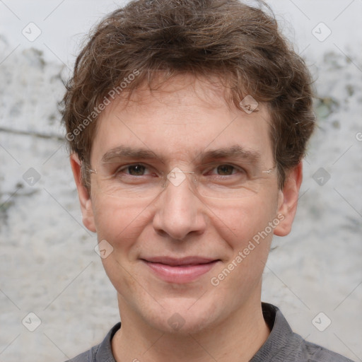 Joyful white adult male with short  brown hair and grey eyes