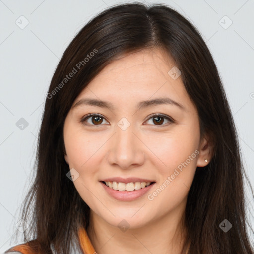 Joyful white young-adult female with long  brown hair and brown eyes