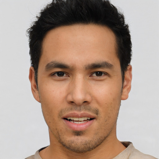 Joyful asian young-adult male with short  brown hair and brown eyes
