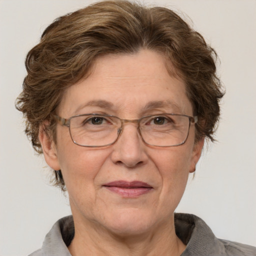 Joyful white middle-aged female with short  brown hair and grey eyes