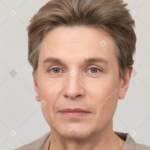 Joyful white adult male with short  brown hair and grey eyes